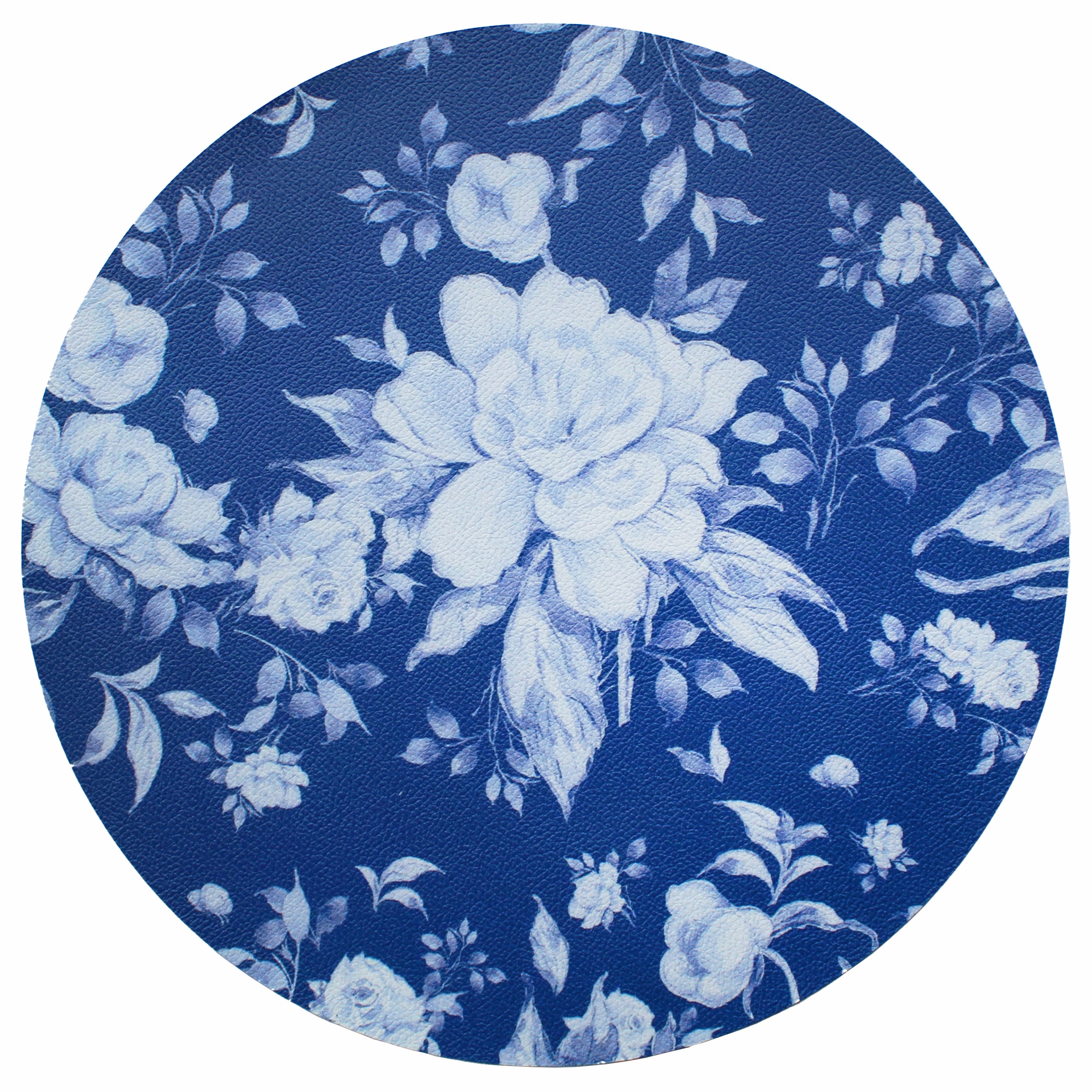 Mantel individual redondo de piel sintética. Flores blancas en fondo azul por un lado y blanco por el otro. Modelo Elisa